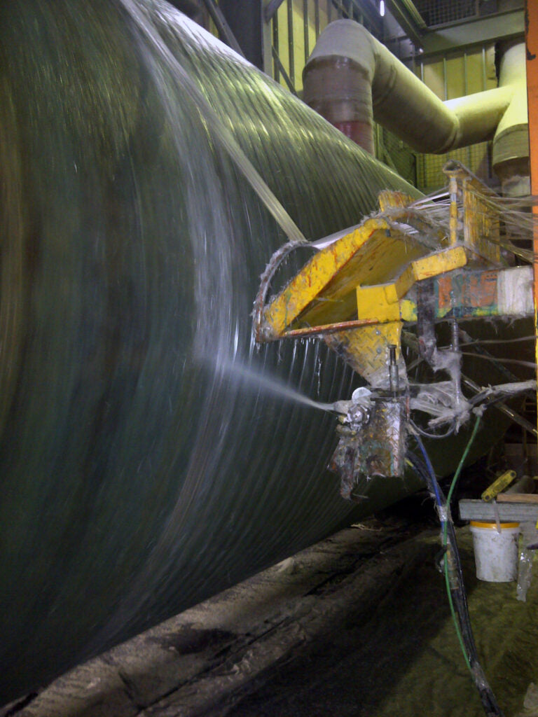 Filament winding process used to manufacture reinforced fibreglass tanks for Protector stormwater treatment systems.