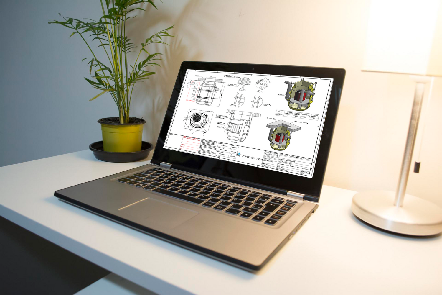 Engineering design drawings for a stormwater treatment system displayed on a laptop during the product development and design process.